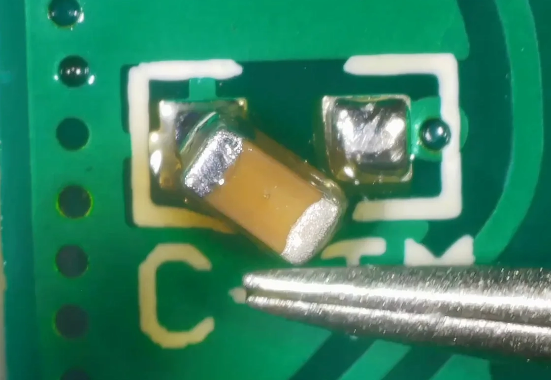 Soldering a 0.22 µF capacitor onto the CTM pad